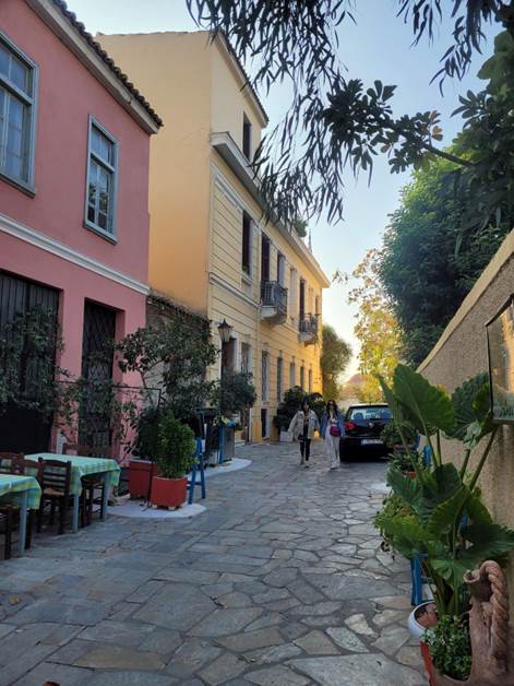 A picture containing outdoor, building, tree, street
Description automatically generated